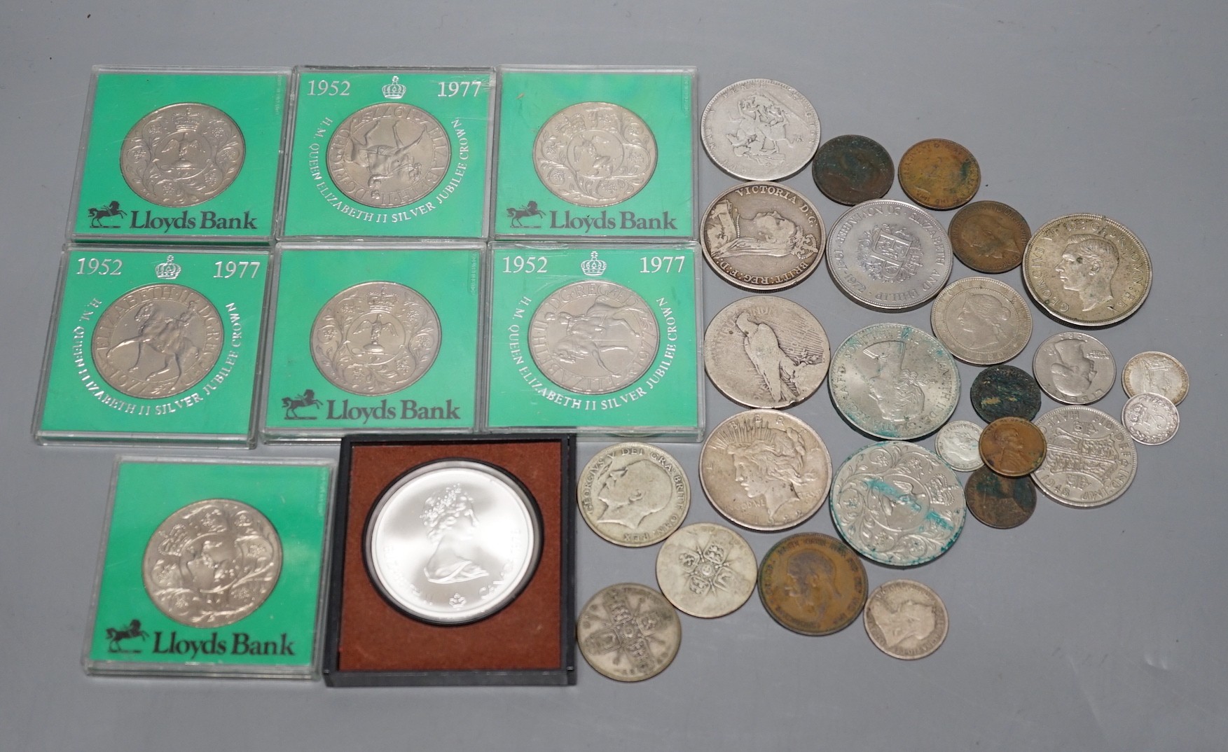 A group of mostly UK crowns and other coins, some pre-1920 silver coins and a 1976 Montréal Olympics commemorative silver coin